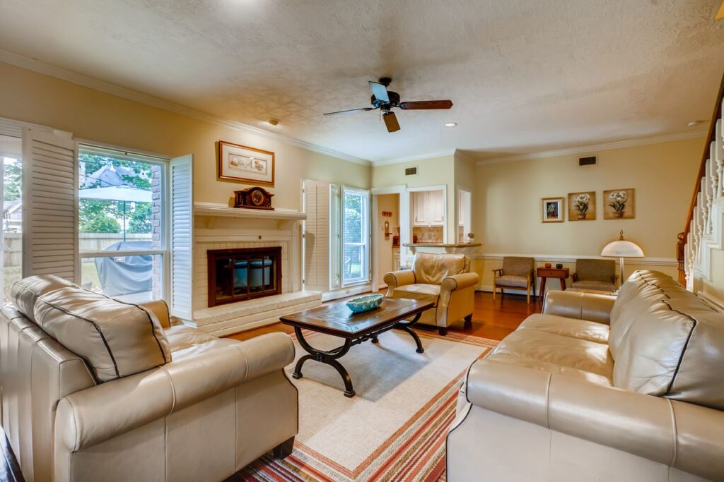 Spacious living room featuring comfortable sofas and chic decor in a well-lit interior.